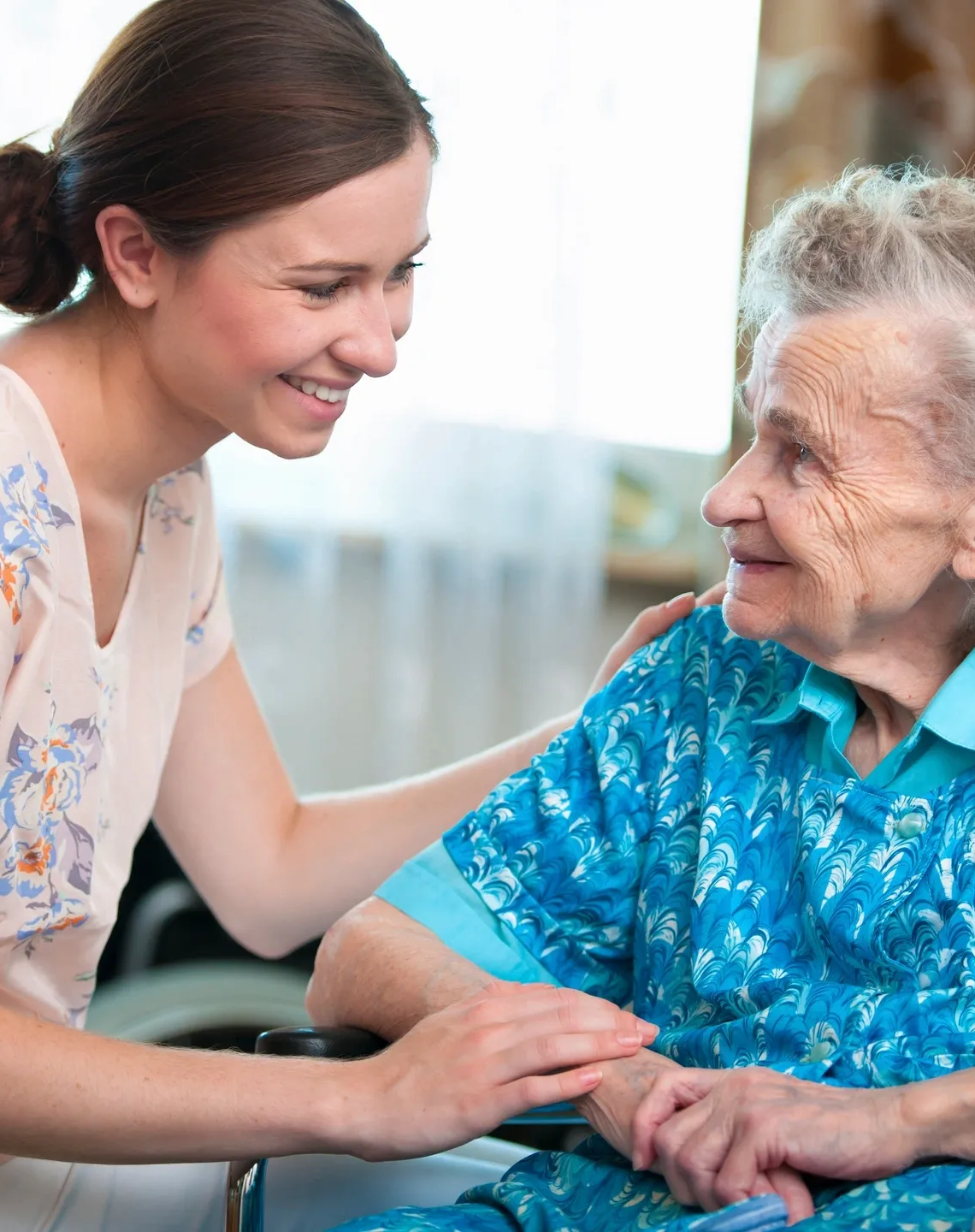 Caregiver White Female Patient On Wheelchair zoom in